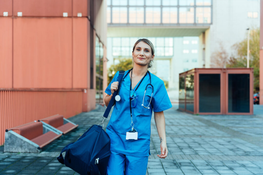 travel nurse walking into a hospital